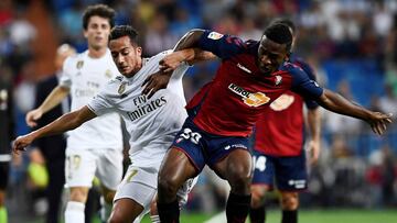 Real Madrid&#039;s Spanish forward Lucas Vazquez (L) vies with Osasuna&#039;s Ecuadorean defender Pervis Estupinan during the Spanish league football match between Real Madrid CF and CA Osasuna at the Santiago Bernabeu stadium in Madrid, on September 25, 