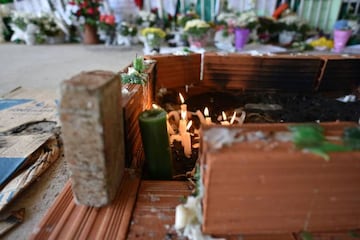 People pay tribute to the players of Brazilian team Chapecoense Real at the club's Arena Conda stadium in Chapeco.