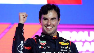 JEDDAH, SAUDI ARABIA - MARCH 19: Race winner Sergio Perez of Mexico and Oracle Red Bull Racing celebrates on the podium during the F1 Grand Prix of Saudi Arabia at Jeddah Corniche Circuit on March 19, 2023 in Jeddah, Saudi Arabia. (Photo by Peter Fox/Getty Images)