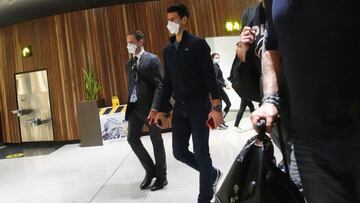 Serbian tennis player Novak Djokovic walks in Melbourne Airport before boarding a flight, after the Federal Court upheld a government decision to cancel his visa to play in the Australian Open, in Melbourne, Australia, January 16, 2022. REUTERS/Loren Elli