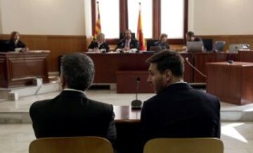 FC Barcelona's Lionel Messi (R) and his father Jorge Horacio Messi (L) in Barcelona's high court.