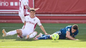 ALBACETE, SPAIN - APRIL 04: Oscar Gil of RCD Espanyol is fouled by Manuel Fuster of Albacete BP during the Liga Smartbank match between Albacete BP and RCD Espanyol de Barcelona at Estadio Carlos Belmonte on April 04, 2021 in Albacete, Spain. Sporting sta