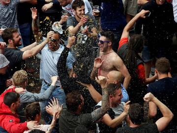 English fans celebrate their win over Wales with a beer shower.