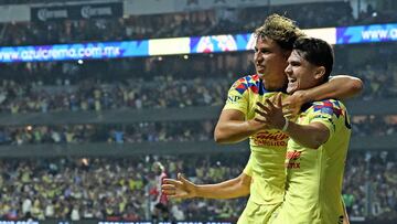 America�s Igor Lichnovsky (L) and goal scorer Israel Reyes (R) celebrate after scoring against Guadalajara during the second leg of their 2024 Mexican Clausura semi-final match at Azteca football stadium in Mexico City on May 18, 2024. (Photo by CARL DE SOUZA / AFP)