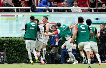 Aldo Rocha (C) of Atlas celebrates his goal against Guadalajara with teammates during the Liga MX Apertura tournament football match between Guadalajara and Atlas at the Akron stadium in Guadalajara, Jalisco State, Mexico, on November 21, 2024. (Photo by ULISES RUIZ / AFP)