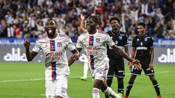 Lyon's Cameroonian forward Karl Toko Ekambi (L) celebrates after scoring his team's second goal during the French L1 football match between Olympique Lyonnais (OL) and AJ Auxerre at The Groupama Stadium in Decines-Charpieu, central-eastern France on August 31, 2022. (Photo by OLIVIER CHASSIGNOLE / AFP) (Photo by OLIVIER CHASSIGNOLE/AFP via Getty Images)