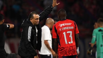 Independiente Medellin's coach Alejandro Restrepo (L) gives instructions to midfielder #13 Francisco Chaverra during the Copa Libertadores phase three second-leg football match between Colombia's Independiente Medellin and Uruguay's Juventud at the Atanasio Girardot Stadium in Medellin, Colombia on March 12, 2026. (Photo by Jaime SALDARRIAGA / AFP)