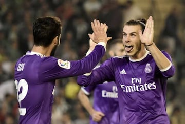 Isco (left) and Gareth Bale celebrate as Real thrash Betis in Seville.