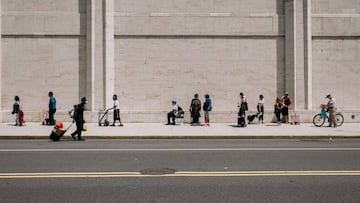 NEW YORK, NY - JULY 29: New Yorkers in need wait in a long line to receive free produce, dry goods, and meat at a Food Bank For New York City distribution event at Lincoln Center on July 29, 2020 in New York City. In addition to unemployment and homelessn