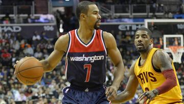 Feb 28, 2016; Washington, DC, USA; Washington Wizards guard Ramon Sessions (7) looks to pass as Cleveland Cavaliers guard Kyrie Irving (2) defends during the second half at Verizon Center. Washington Wizards defeated Cleveland Cavaliers 113-99. Mandatory Credit: Tommy Gilligan-USA TODAY Sports