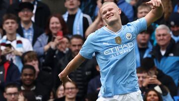 Manchester City's Norwegian striker #09 Erling Haaland celebrates after scoring their third goal from the penalty spot during the English Premier League football match between Manchester City and Luton Town at the Etihad Stadium in Manchester, north west England, on April 13, 2024. (Photo by Darren Staples / AFP) / RESTRICTED TO EDITORIAL USE. No use with unauthorized audio, video, data, fixture lists, club/league logos or 'live' services. Online in-match use limited to 120 images. An additional 40 images may be used in extra time. No video emulation. Social media in-match use limited to 120 images. An additional 40 images may be used in extra time. No use in betting publications, games or single club/league/player publications. / 