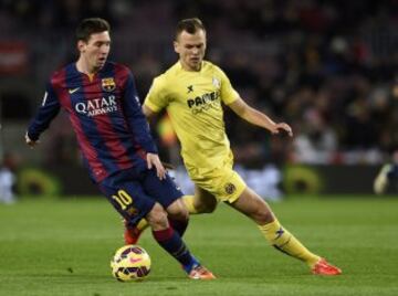 Lionel Messi y Denis Cheryshev.