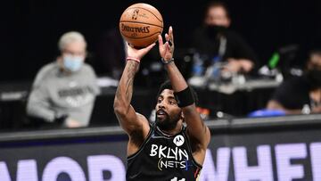 NEW YORK, NEW YORK - JUNE 07:  Kyrie Irving #11 of the Brooklyn Nets attempts a jump shot against the Milwaukee Bucks in Game Two of the Second Round of the 2021 NBA Playoffs at Barclays Center on June 07, 2021 in New York City. NOTE TO USER: User express