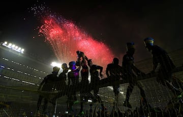 Boca Juniors' players celebrate with the trophy after they clinched the Argentine tournament