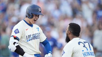 LOS ANGELES, CALIFORNIA - JULY 06: Shohei Ohtani #17 of the Los Angeles Dodgers celebrates with his teammate Teoscar Hern�ndez #37 after hitting a solo home run against the Milwaukee Brewers during the eighth inning at Dodger Stadium on July 06, 2024 in Los Angeles, California.   Michael Owens/Getty Images/AFP (Photo by Michael Owens / GETTY IMAGES NORTH AMERICA / Getty Images via AFP)