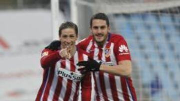 Koke celebra con Torres el gol marcado al Getafe.