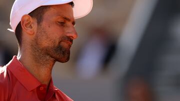 Serbia's Novak Djokovic reacts during his men's singles round of sixteen match against Argentina's Francisco Cerundolo on Court Philippe-Chatrier on day nine of the French Open tennis tournament at the Roland Garros Complex in Paris on June 3, 2024. (Photo by Emmanuel Dunand / AFP)