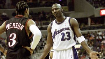 Washington Wizards Micheal Jordan (R) talks to Philadelphia 76ers Allen Iverson during the second quarter at the MCI Center in Washington, November 30, 2002.   REUTERS/Jessica Persson