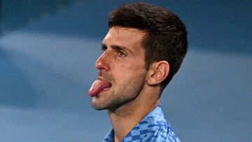 Serbia's Novak Djokovic reacts on a point against Bulgaria's Grigor Dimitrov during their men's singles match on day six of the Australian Open tennis tournament in Melbourne on January 21, 2023. (Photo by ANTHONY WALLACE / AFP) / -- IMAGE RESTRICTED TO EDITORIAL USE - STRICTLY NO COMMERCIAL USE --