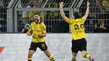 Dortmund's German forward #14 Niclas Fuellkrug (L) celebrates scoring the opening goal with his teammate Dortmund's Austrian midfielder #20 Marcel Sabitzer during the UEFA Champions League semi-final first leg football match between Borussia Dortmund and Paris Saint-Germain (PSG) on May 1, 2024 in Dortmund. (Photo by INA FASSBENDER / AFP)