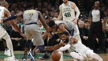 Mar 29, 2019; Boston, MA, USA; Boston Celtics guard Kyrie Irving (11) competes for a loose ball against Indiana Pacers forward Thaddeus Young (21) and guard Darren Collison (2) in the second quarter at TD Garden. Mandatory Credit: David Butler II-USA TODAY Sports