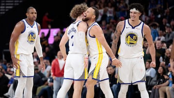 INGLEWOOD, CALIFORNIA - APRIL 15: Stephen Curry #30 of the Golden State Warriors reacts with Brandin Podziemski #2 after a three-point shot against the LA Clippers to go up 120-117 in the second half of an NBA play-in tournament game at Intuit Dome on April 15, 2026 in Inglewood, California. NOTE TO USER: User expressly acknowledges and agrees that, by downloading and or using this photograph, User is consenting to the terms and conditions of the Getty Images License Agreement. Ronald Martinez/Getty Images/AFP (Photo by RONALD MARTINEZ / GETTY IMAGES NORTH AMERICA / Getty Images via AFP)