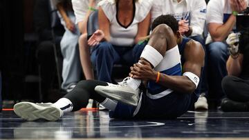 MINNEAPOLIS, MINNESOTA - MAY 08: Anthony Edwards #5 of the Minnesota Timberwolves reacts to his injury against the Golden State Warriors in the second quarter of Game Two of the Western Conference Second Round NBA Playoffs at Target Center on May 08, 2025 in Minneapolis, Minnesota. NOTE TO USER: User expressly acknowledges and agrees that, by downloading and or using this photograph, User is consenting to the terms and conditions of the Getty Images License Agreement. David Berding/Getty Images/AFP (Photo by David Berding / GETTY IMAGES NORTH AMERICA / Getty Images via AFP)