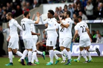 Leroy Fer celebrates with team mates after putting Swansea ahead.