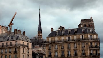 A view shows the new spire, surmounted by the rooster and the cross, of the Notre-Dame de Paris Cathedral, which was ravaged by a fire in 2019, as restoration works continue in Paris, France, March 30, 2024. REUTERS/Gonzalo Fuentes