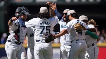 SEATTLE, WA - JULY 04: (L-R) Cal Raleigh #29 of the Seattle Mariners, Andres Munoz #75, J.P. Crawford #3, Josh Rojas #4 and Ryan Bliss #1 celebrate after a game against the Baltimore Orioles at T-Mobile Park on July 4, 2024 in Seattle, Washington. The Mariners won 7-3.   Stephen Brashear/Getty Images/AFP (Photo by STEPHEN BRASHEAR / GETTY IMAGES NORTH AMERICA / Getty Images via AFP)