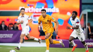 DOHA, QATAR - DECEMBER 03: Cody Gakpo (C) of Netherlands is tackled by Yunus Musah (R) of USA during the FIFA World Cup Qatar 2022 Round of 16 match between Netherlands and USA at Khalifa International Stadium on December 03, 2022 in Doha, Qatar. (Photo by Marvin Ibo Guengoer - GES Sportfoto/Getty Images)