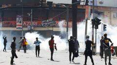 Demonstrators gesture as police use tear gas to disperse protesters during a demonstration against Kenya's proposed finance bill 2024/2025 in Nairobi, Kenya, June 25, 2024. REUTERS/Monicah Mwangi