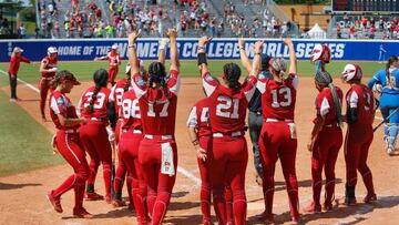 OKLAHOMA CITY, OK - JUNE 6:  The Oklahoma Sooners gather around the plate to welcome Jocelyn Alo #78 after her grand slam against the ULCA Bruins in the fifth inning during the NCAA Women's College World Series at the USA Softball Hall of Fame Complex on June 6, 2022 in Oklahoma City, Oklahoma.  Oklahoma won the elimination game 15-0.  (Photo by Brian Bahr/Getty Images)