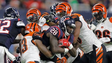 HOUSTON, TX - DECEMBER 24: Alfred Blue #28 of the Houston Texans is wrapped up by George Iloka #43 of the Cincinnati Bengals in the second half at NRG Stadium on December 24, 2016 in Houston, Texas. Houston won 12-10 to win the AFC South division.   Bob Levey/Getty Images/AFP
 == FOR NEWSPAPERS, INTERNET, TELCOS &amp; TELEVISION USE ONLY ==