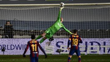 Barcelona's goalkeeper Marc-Andre ter Stegen makes a save during Spanish Super Cup semi final soccer match between Barcelona and Real Sociedad at Nuevo Arcangel stadium in Cordoba, Spain, Wednesday, Jan. 13, 2021. (AP Photo/Jose Breton)