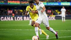 VILLARREAL, SPAIN - JANUARY 19: Samu Chukwueze of Villarreal CF competes for the ball with Marco Asensio of Real Madrid during the Copa del Rey Round of 16 match between Villarreal CF and Real Madrid at Estadio de la Ceramica on January 19, 2023 in Villarreal, Spain. (Photo by Manuel Queimadelos/Quality Sport Images/Getty Images)