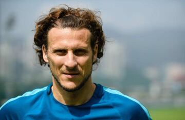 Uruguayan player Diego Forlan poses before a team training session with Hong Kong Premier League football club Kitchee in Hong Kong.