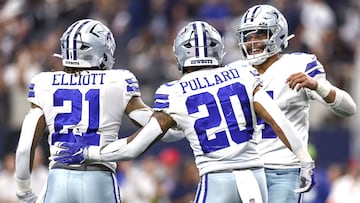 ARLINGTON, TEXAS - OCTOBER 23: Dak Prescott #4 of the Dallas Cowboys celebrates with Ezekiel Elliott #21 and Tony Pollard #20 after a touchdown against the Detroit Lions during the fourth quarter at AT&T Stadium on October 23, 2022 in Arlington, Texas.   Tom Pennington/Getty Images/AFP