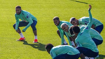 (From L) Brazil's forward Neymar, Brazil's forward Rodrygo, Brazil's forward Pedro and Brazil's midfielder Bruno Guimaraes stretch during a training session on November 18, 2022 at the Continassa training ground in Turin, as part of Brazil's preparation ahead of the Qatar 2022 World Cup. (Photo by Isabella BONOTTO / AFP)