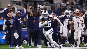 ARLINGTON, TEXAS - NOVEMBER 23: DaRon Bland #26 of the Dallas Cowboys returns an interception for a touchdown in the game against the Washington Commanders during the fourth quarter at AT&T Stadium on November 23, 2023 in Arlington, Texas.   Richard Rodriguez/Getty Images/AFP (Photo by Richard Rodriguez / GETTY IMAGES NORTH AMERICA / Getty Images via AFP)