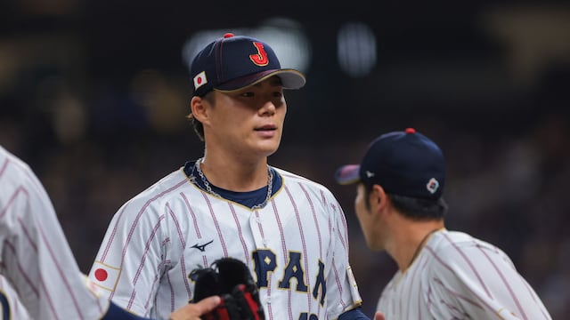 Mar 14, 2026; Miami, FL, United States; Japan starting pitcher Yoshinobu Yamamoto (18) returns to the dugout against Venezuela in the first inning during a quarterfinal game of the 2026 World Baseball Classic at loanDepot Park. Mandatory Credit: Sam Navarro-Imagn Images