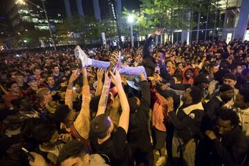 TORONTO, ON - JUNE 13: Toronto Raptors fans cheer after the team beat the Golden State Warriors in Game Six of the NBA Finals, during a viewing party in Jurassic Park outside of Scotiabank Arena on June 13, 2019 in Toronto, Canada.   