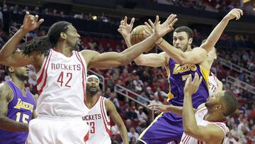 Dec 7, 2016; Houston, TX, USA; Los Angeles Lakers forward Larry Nance Jr. (7) and Houston Rockets center Nene Hilario (42) and guard Eric Gordon (10) reach for a rebound in the second half at Toyota Center. The Houston Rockets won 134 to 95. Mandatory Credit: Thomas B. Shea-USA TODAY Sports