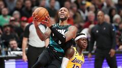 Damian Lillard #0 of the Portland Trail Blazers drives to the basket past Dennis Schroder #17 of the Los Angeles Lakers during the fourth quarter at Moda Center on February 13, 2023 in Portland, Oregon.