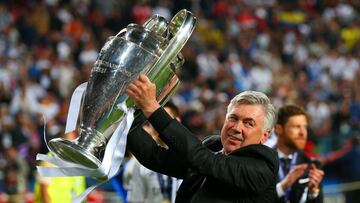 LISBON, PORTUGAL - MAY 24:  Head Coach, Carlo Ancelotti of Real Madrid celebrates with the Champions League trophy during the UEFA Champions League Final between Real Madrid and Atletico de Madrid at Estadio da Luz on May 24, 2014 in Lisbon, Portugal.  (P