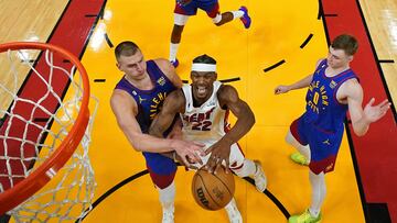 Jun 7, 2023; Miami, Florida, USA; Denver Nuggets center Nikola Jokic (15) knocks the ball away from Miami Heat forward Jimmy Butler (22) during the second half in game three of the 2023 NBA Finals at Kaseya Center. Mandatory Credit: Kyle Terada-USA TODAY Sports