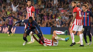 Barcelona's French forward Ousmane Dembele (L) looks on after scoring his team's first goal during the Spanish league football match between FC Barcelona and Athletic Club Bilbao at the Camp Nou stadium in Barcelona, on October 23, 2022. (Photo by Josep LAGO / AFP)