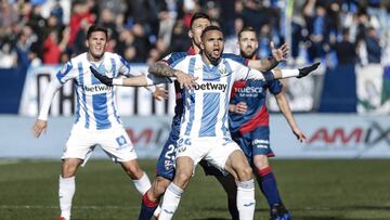 Youssef En-Nesyri (Leganes FC) challenges for control of the ball with Damian Musto (SD Huesca),   La Liga match between Leganes FC vs SD Huesca at the Municipal de Butarque stadium in Madrid, Spain, January 12, 2019 .