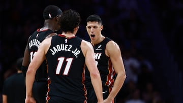 MIAMI, FLORIDA - OCTOBER 26: Simone Fontecchio #0 of the Miami Heat reacts with teammates Jaime Jaquez Jr. #11 and Bam Adebayo #13 against the New York Knicks during the second half at Kaseya Center on October 26, 2025 in Miami, Florida. NOTE TO USER: User expressly acknowledges and agrees that, by downloading and or using this photograph, User is consenting to the terms and conditions of the Getty Images License Agreement.   Carmen Mandato/Getty Images/AFP (Photo by Carmen Mandato / GETTY IMAGES NORTH AMERICA / Getty Images via AFP)