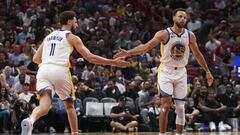 MIAMI, FL - NOVEMBER 01: Stephen Curry #30 of the Golden State Warriors congratulates Klay Thompson #11 after making a three-point shot during the second half against the Miami HEAT at FTX Arena on November 1, 2022 in Miami, Florida. NOTE TO USER: User expressly acknowledges and agrees that, by downloading and or using this photograph, User is consenting to the terms and conditions of the Getty Images License Agreement.  Eric Espada/Getty Images/AFP